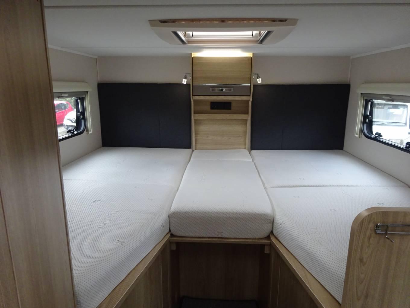 Family motorhome interior with sleeping spaces