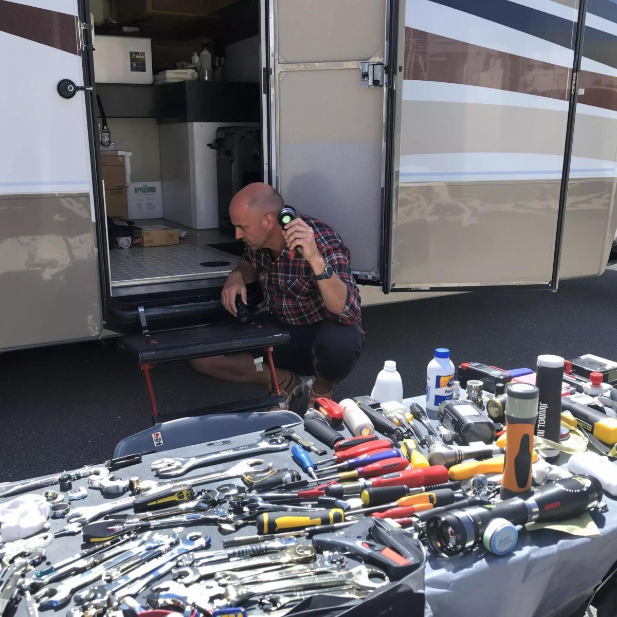 Person repairing motorhome exterior