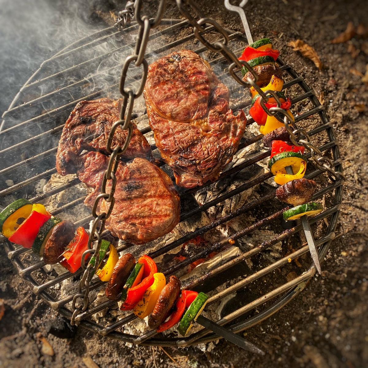 Steak vegetable skewers at campsite