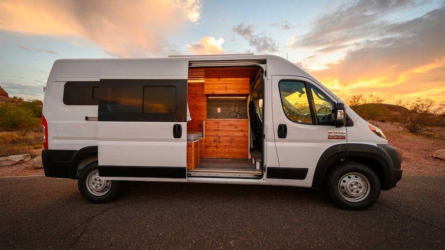 Converted campervan interior with bed