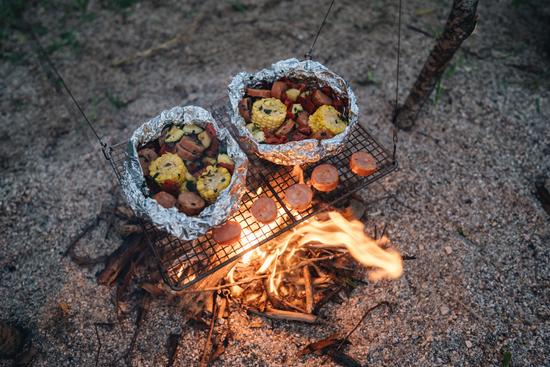 Foil packet meal over campfire