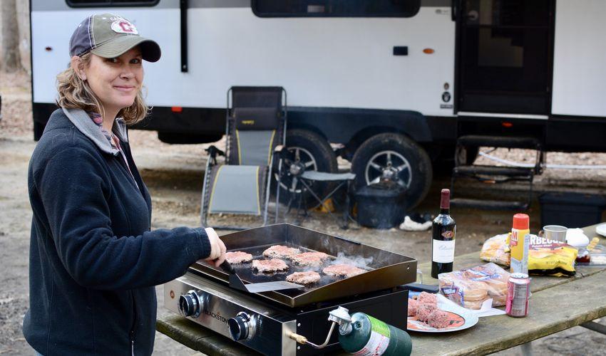 Campfire burgers near RV